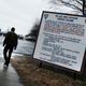 A man enters the road to Rikers Island on March 31, 2017, in New York City. That month, Mayor Bill de Blasio announced that the controversial jail will be closed within the next 10 years. (Spencer Platt/Getty Images)